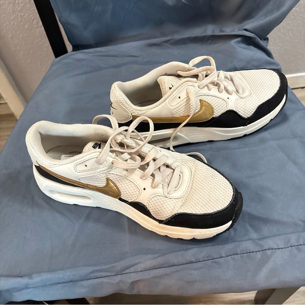 Nike Beige and Black Sneakers with Gold Accent